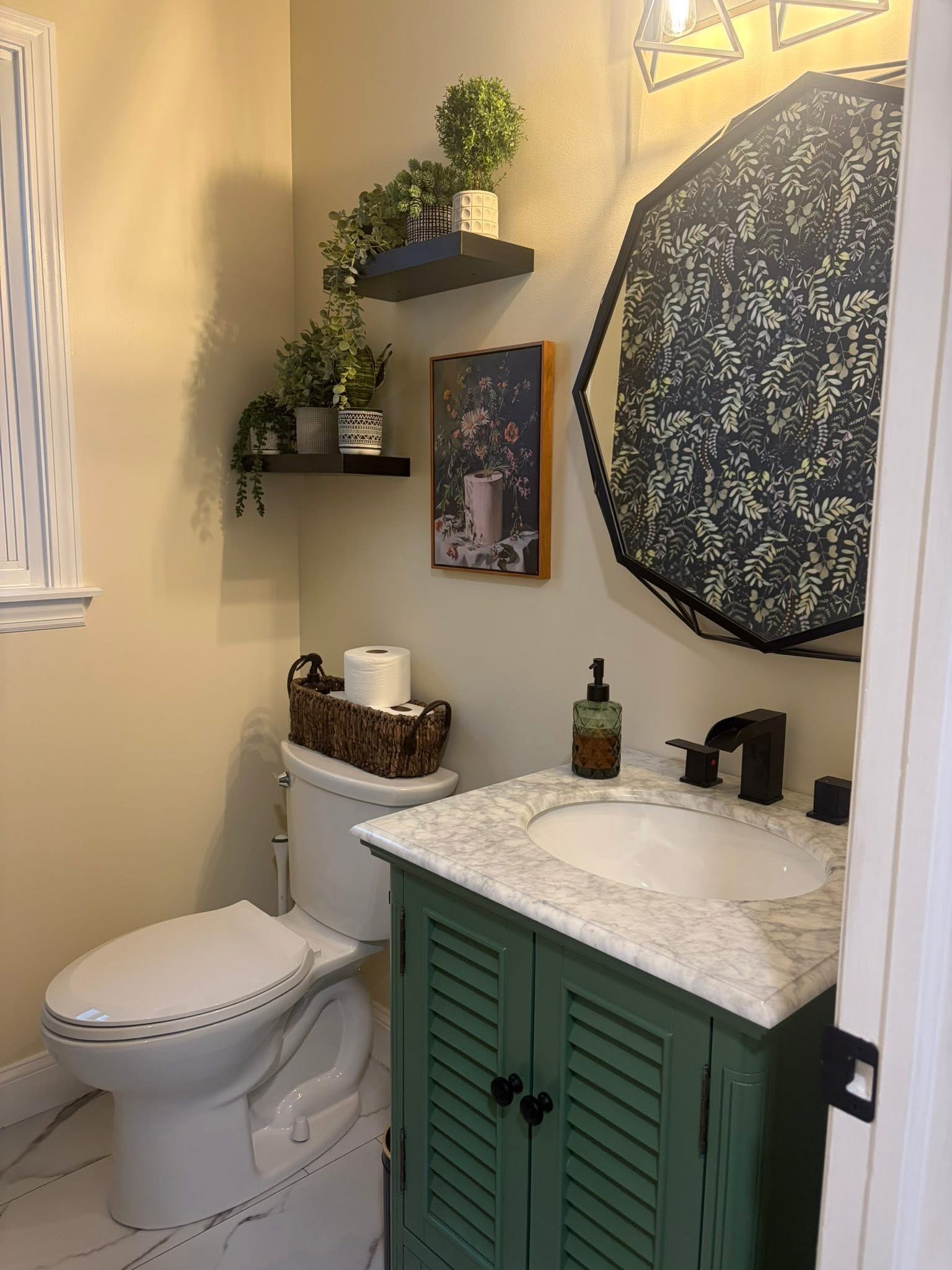 Completed bathroom renovation with custom vanity and marble countertop